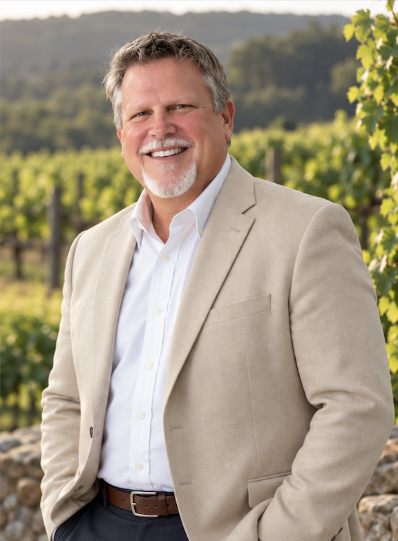 Scott E. Barron standing in a vineyard